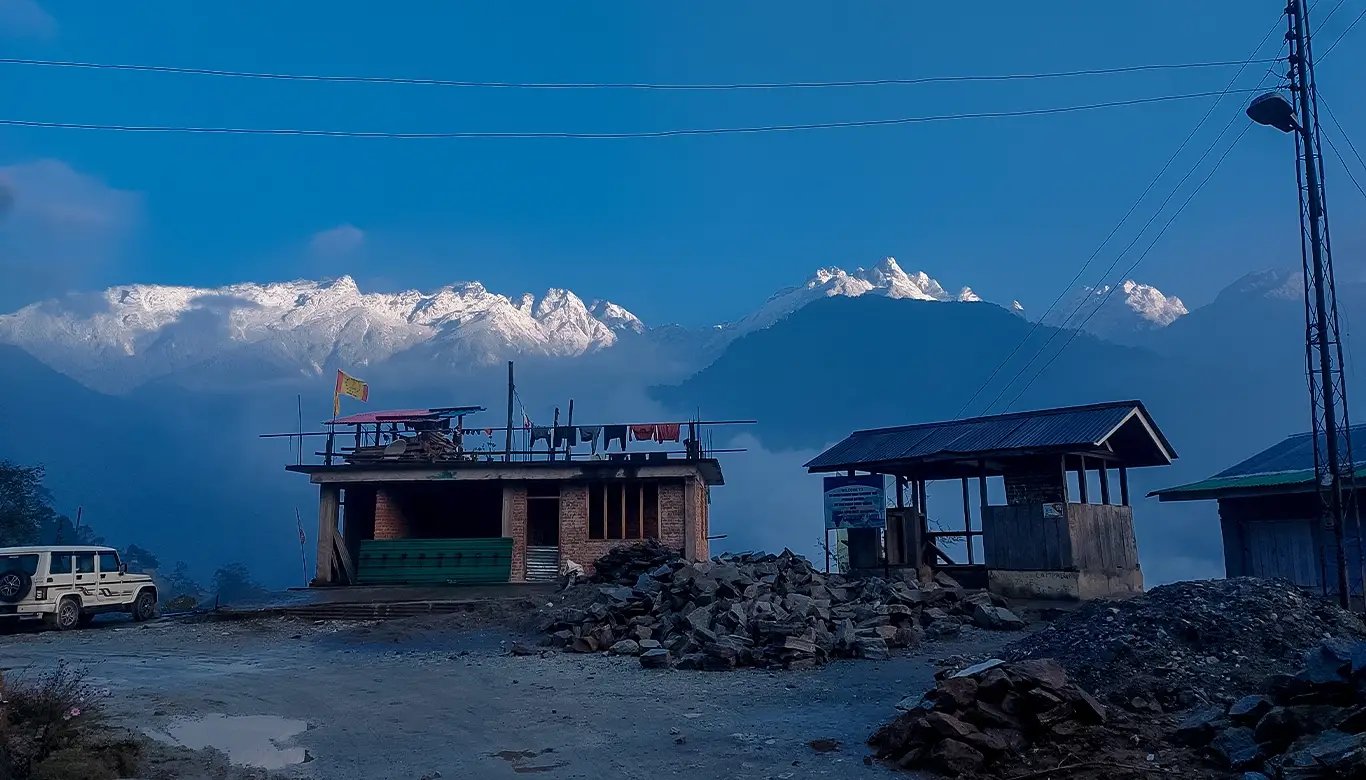 Stunning mountain view seen from Ajit Anjan Homestay in Labdang, West Sikkim, with snow-capped peaks in the background.